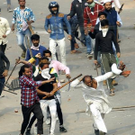 Divided in violence, united in grief: Families of dead say hate is to blame