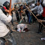 Mob attack on Muslim man in India’s capital captured in dramatic photograph