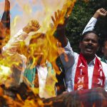 A farmer protest in India turns deadly, leaving 9 dead and a town on edge