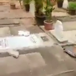 Crosses put atop graves at a cemetery vandalized