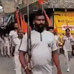 Hindu far-right group Bajrang Dal organize a street march flaunting dozens of guns