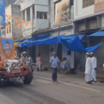 On Eid day, members of the Rashtriya Swayamsevak Sangh were seen marching through the streets carrying sticks