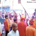 Shobha Yatra participants flash swords while marching through Gaya